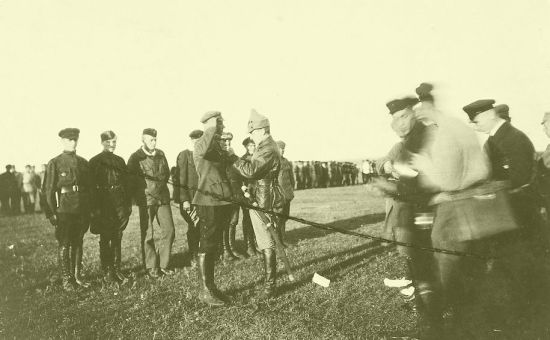 Виктор Галышев - второй слева, на построении. Вручает награды М. Тухачевский, 1921 г. (фрагмент). Любительское фото, автор неизвестен.